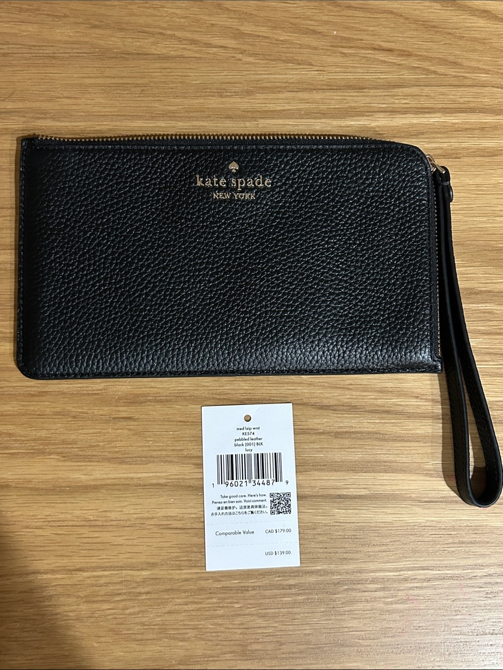 kate spade Black Pebbled Leather Wristlet with Gold Logo Plate